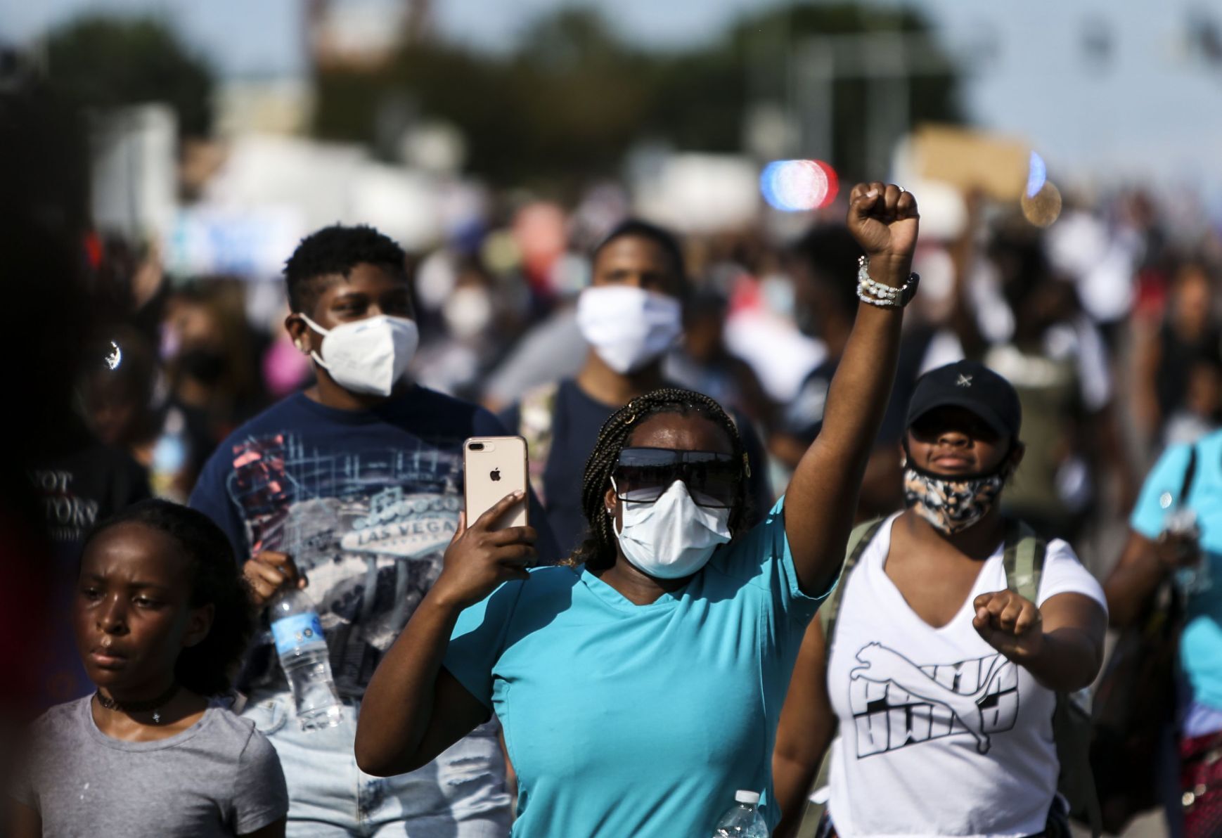 Protesters march down Highway 67